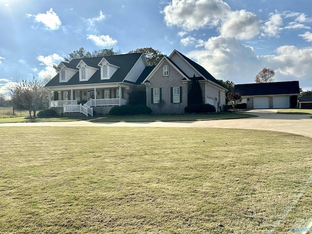 view of front facade with a front lawn and covered porch