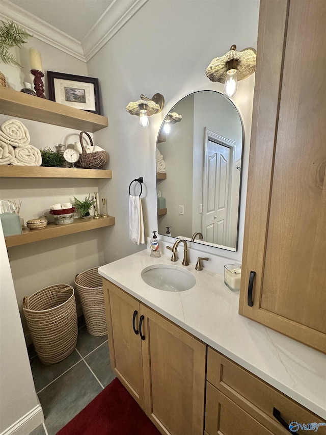 bathroom with vanity, crown molding, and tile patterned floors