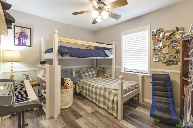 bedroom featuring hardwood / wood-style flooring and ceiling fan