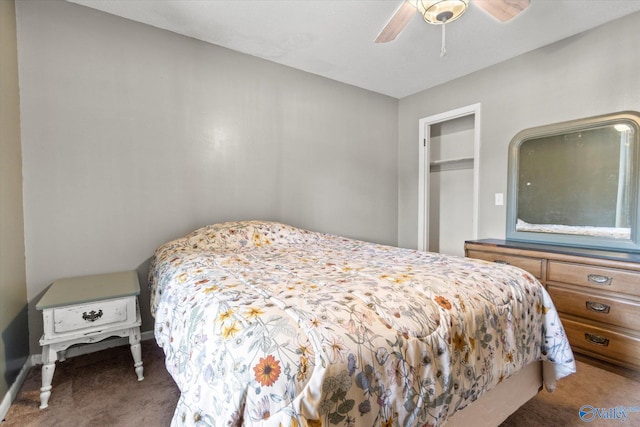 bedroom with dark carpet and a ceiling fan