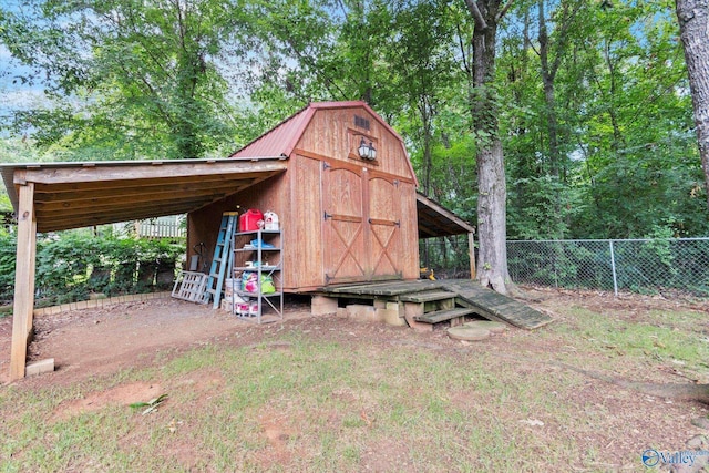 view of shed featuring fence