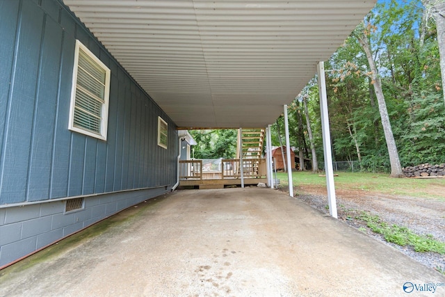 view of patio featuring a deck and an attached carport