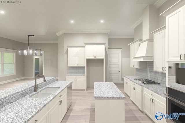 kitchen with light stone counters, sink, stainless steel appliances, and a center island