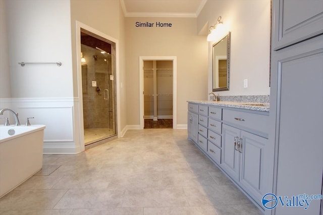 bathroom with crown molding, vanity, and independent shower and bath