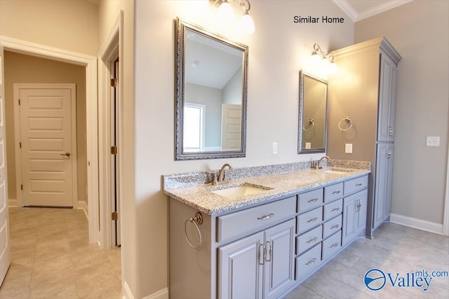 bathroom with tile patterned flooring, vanity, and crown molding