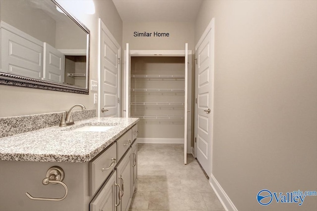 bathroom with vanity and tile patterned flooring