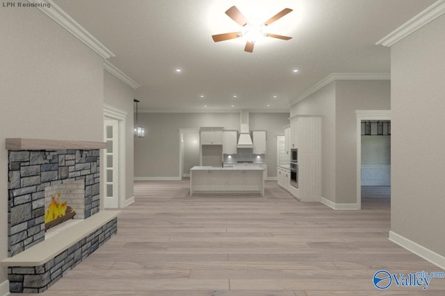 living room with light hardwood / wood-style flooring, a fireplace, ornamental molding, and ceiling fan