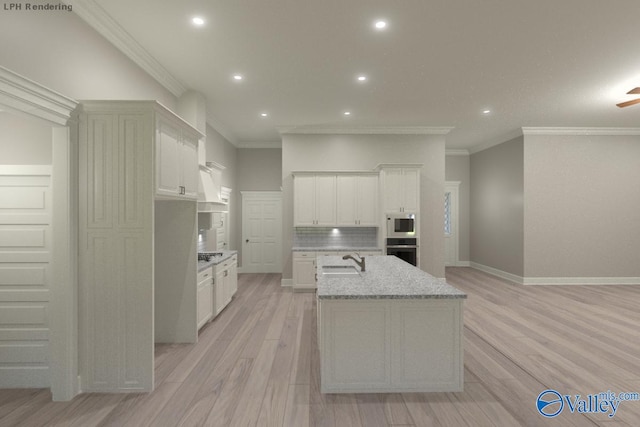 kitchen featuring white cabinetry, stainless steel oven, light stone countertops, and sink