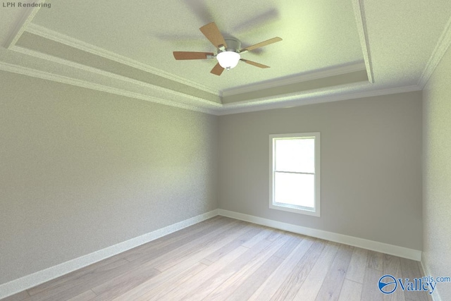 spare room featuring crown molding, light hardwood / wood-style flooring, ceiling fan, and a tray ceiling