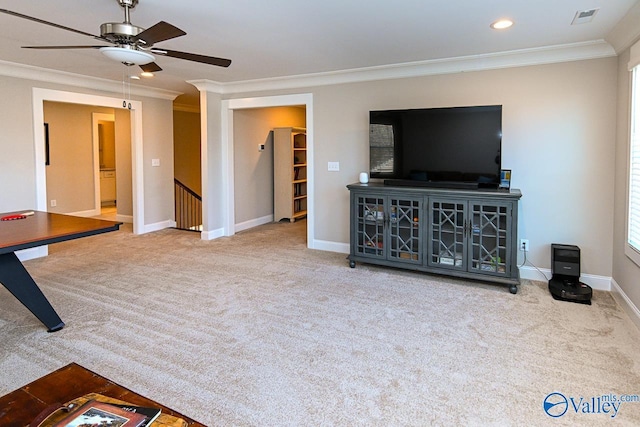 carpeted living area with a ceiling fan, baseboards, visible vents, recessed lighting, and crown molding