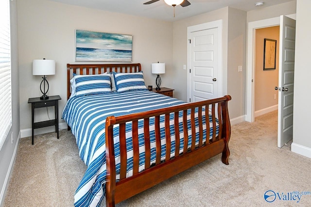 bedroom featuring ceiling fan, baseboards, and carpet