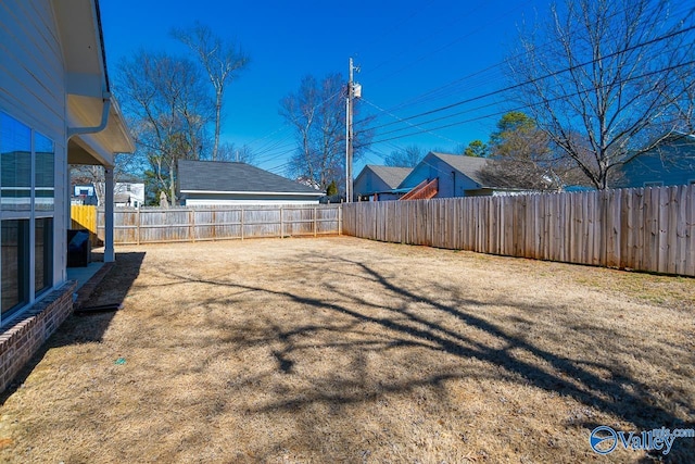 view of yard with a fenced backyard