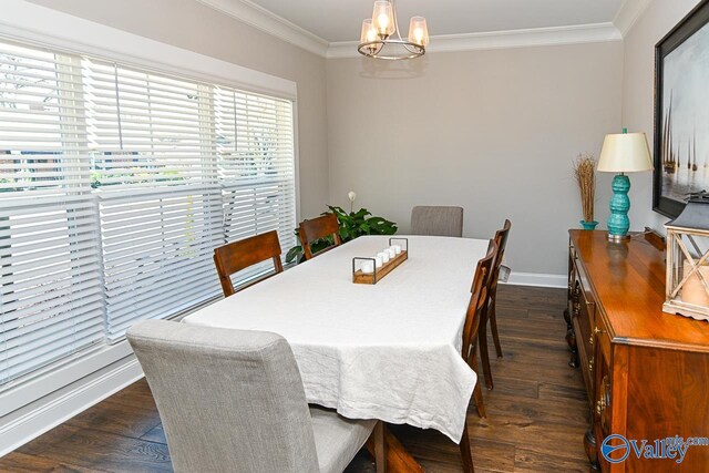 dining space featuring dark wood-style floors, a chandelier, baseboards, and ornamental molding