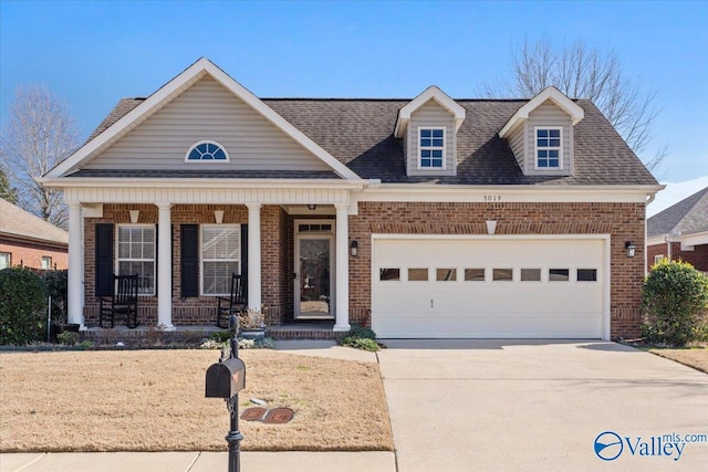 view of front of home featuring a garage and covered porch