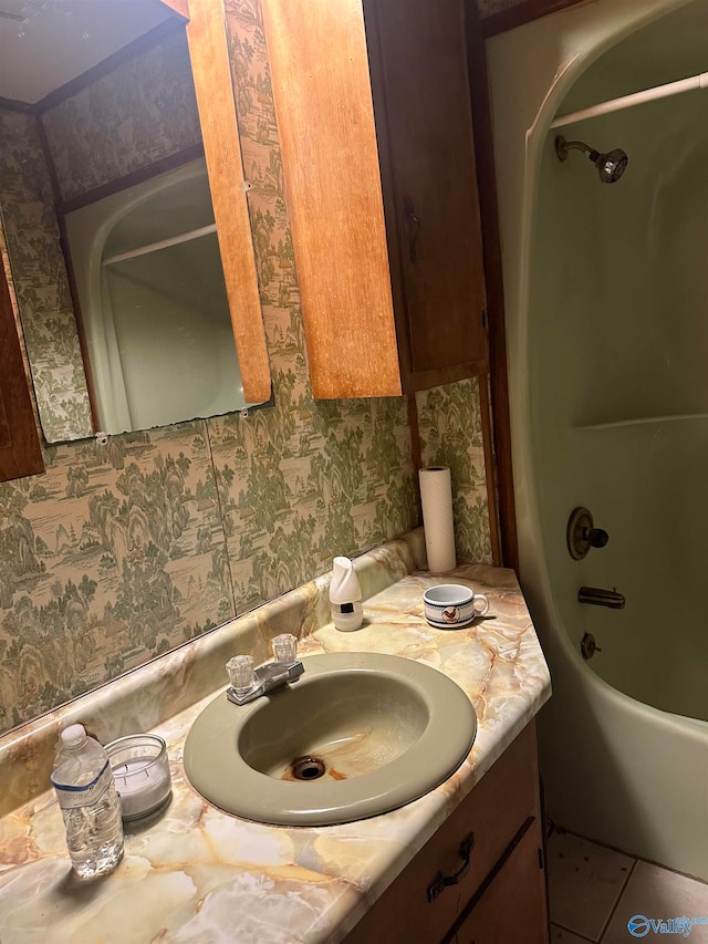 bathroom featuring vanity, bathing tub / shower combination, and tile patterned flooring