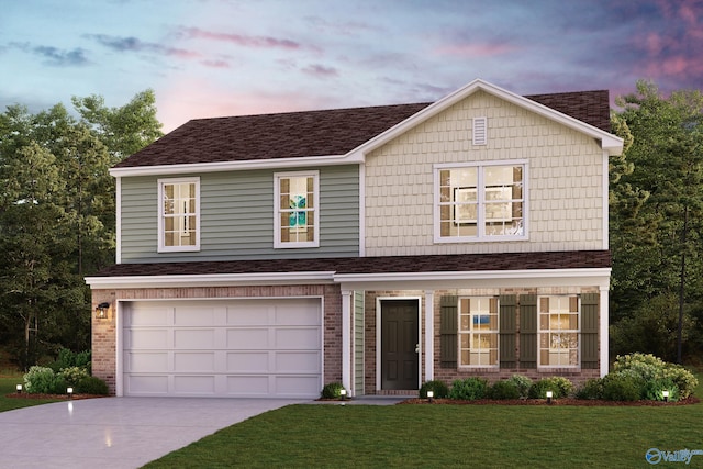 view of front of home featuring a garage and a lawn