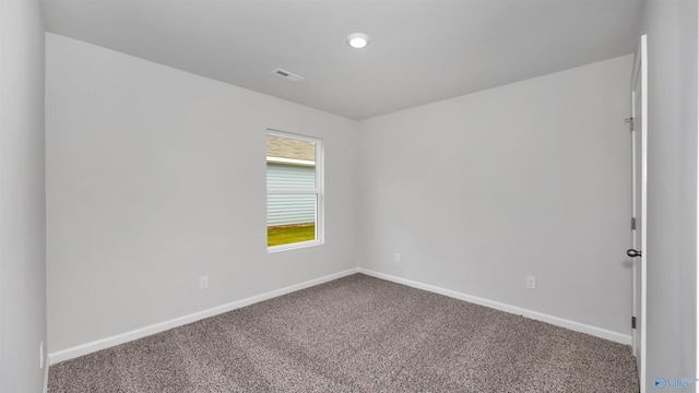 spare room featuring carpet floors