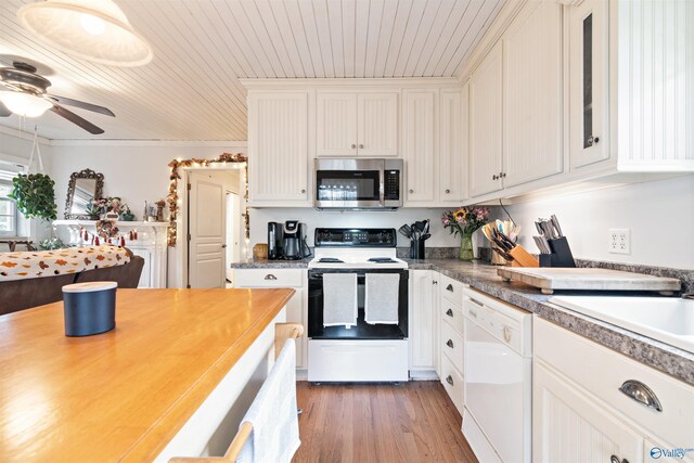 kitchen featuring wooden ceiling, light wood-style floors, electric stove, dishwasher, and stainless steel microwave