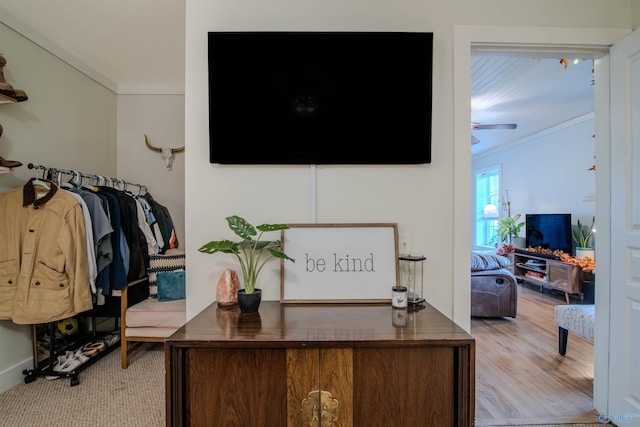 office area featuring ornamental molding and wood finished floors