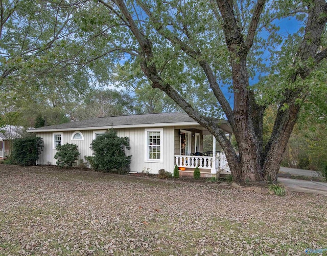 single story home featuring covered porch