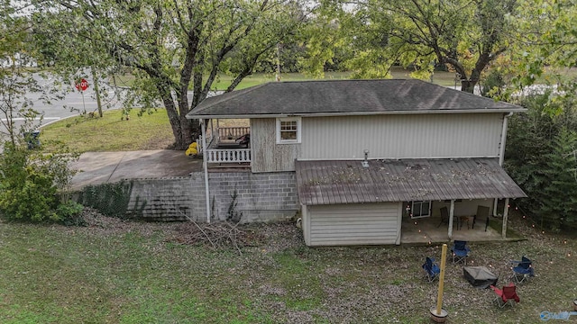 rear view of property with a patio, stairway, a lawn, a wooden deck, and roof with shingles