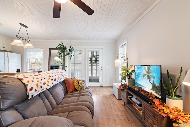 living room with ceiling fan, ornamental molding, wooden ceiling, and light wood-style floors