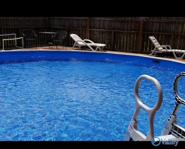 view of pool featuring a fenced in pool and fence