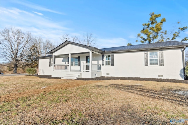 view of front of house with a front yard and a porch