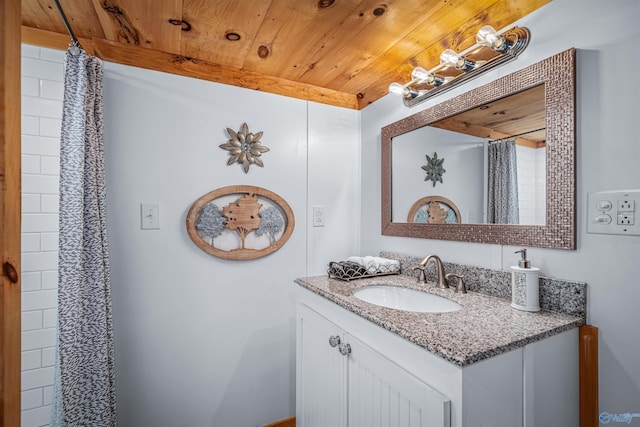 bathroom with a shower with curtain, vanity, and wood ceiling