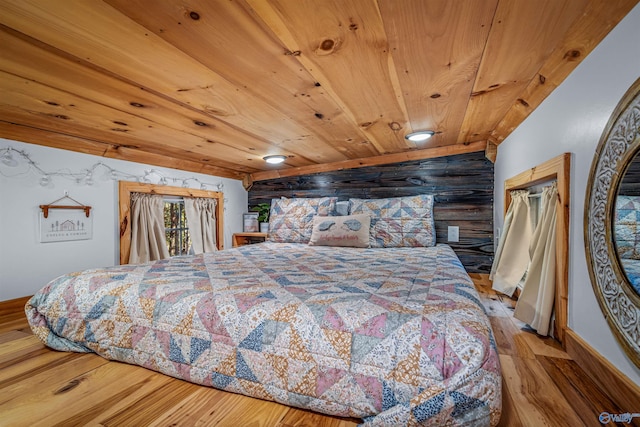 bedroom with light hardwood / wood-style flooring and wood ceiling