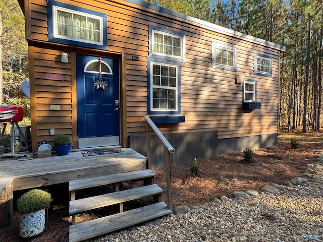 doorway to property featuring a wooden deck