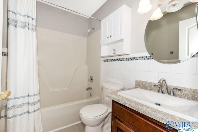 full bathroom with tile walls, shower / bath combination with curtain, toilet, vanity, and tile patterned flooring