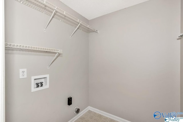 washroom featuring baseboards, laundry area, washer hookup, and hookup for an electric dryer