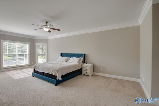 carpeted bedroom with ceiling fan and crown molding