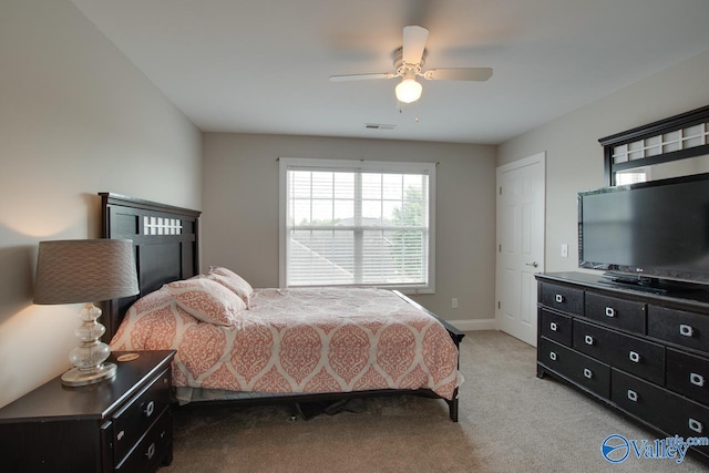 bedroom featuring ceiling fan and light colored carpet