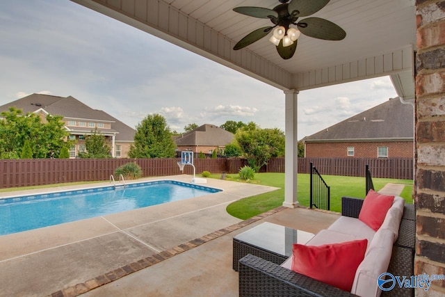 view of pool featuring a lawn, an outdoor living space, ceiling fan, and a patio