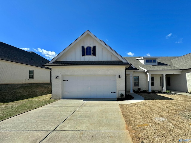 view of front facade with a front yard and a garage