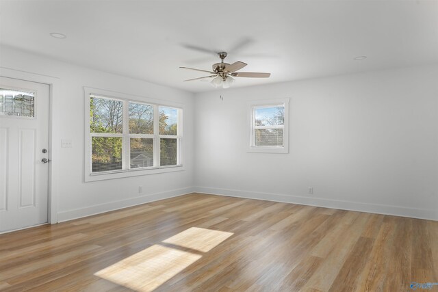 unfurnished room featuring ceiling fan and light hardwood / wood-style floors