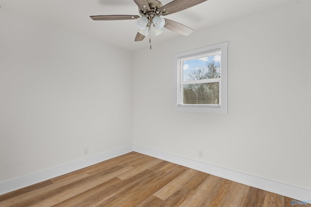 empty room featuring hardwood / wood-style floors and ceiling fan