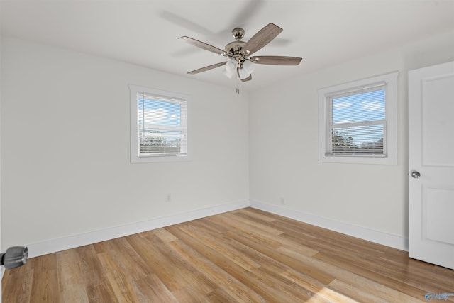 empty room featuring ceiling fan and wood-type flooring