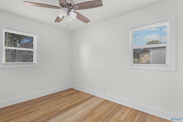 unfurnished room with hardwood / wood-style floors and ceiling fan