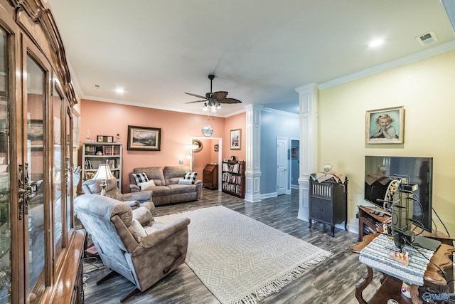 living room with visible vents, ornamental molding, dark wood finished floors, and ceiling fan