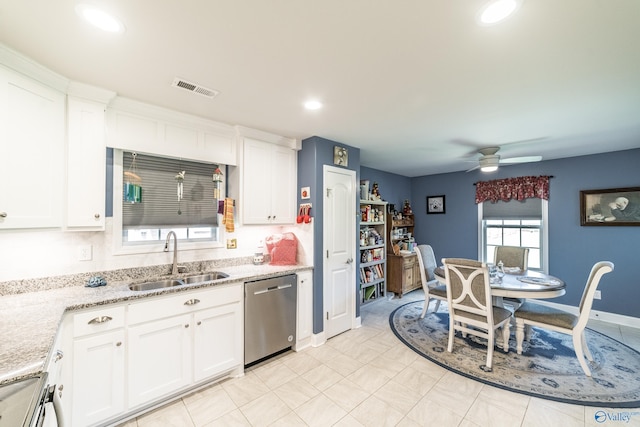 kitchen with white cabinets, visible vents, a sink, and dishwasher