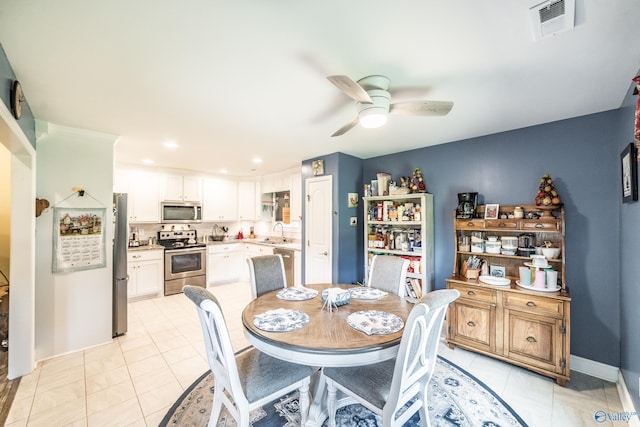 dining space featuring visible vents, baseboards, recessed lighting, a ceiling fan, and light tile patterned floors