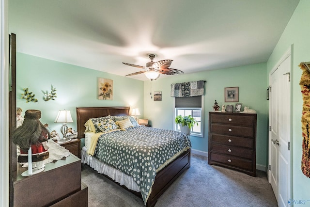 carpeted bedroom featuring baseboards and ceiling fan