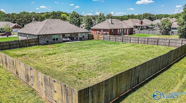 view of yard featuring a fenced backyard