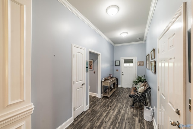 entryway with crown molding, baseboards, and dark wood-style floors