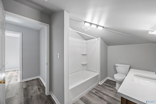 full bathroom featuring toilet, wood finished floors, visible vents, baseboards, and vaulted ceiling