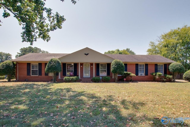 ranch-style home featuring a front lawn, crawl space, and brick siding