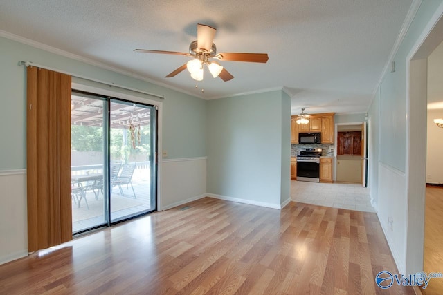 empty room featuring light wood-style floors, baseboards, ornamental molding, and a textured ceiling